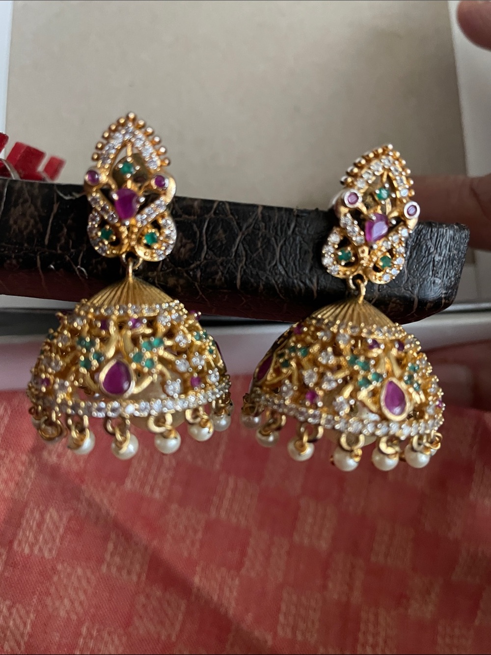 Gold Jhumka Earrings with Purple and Green Stones